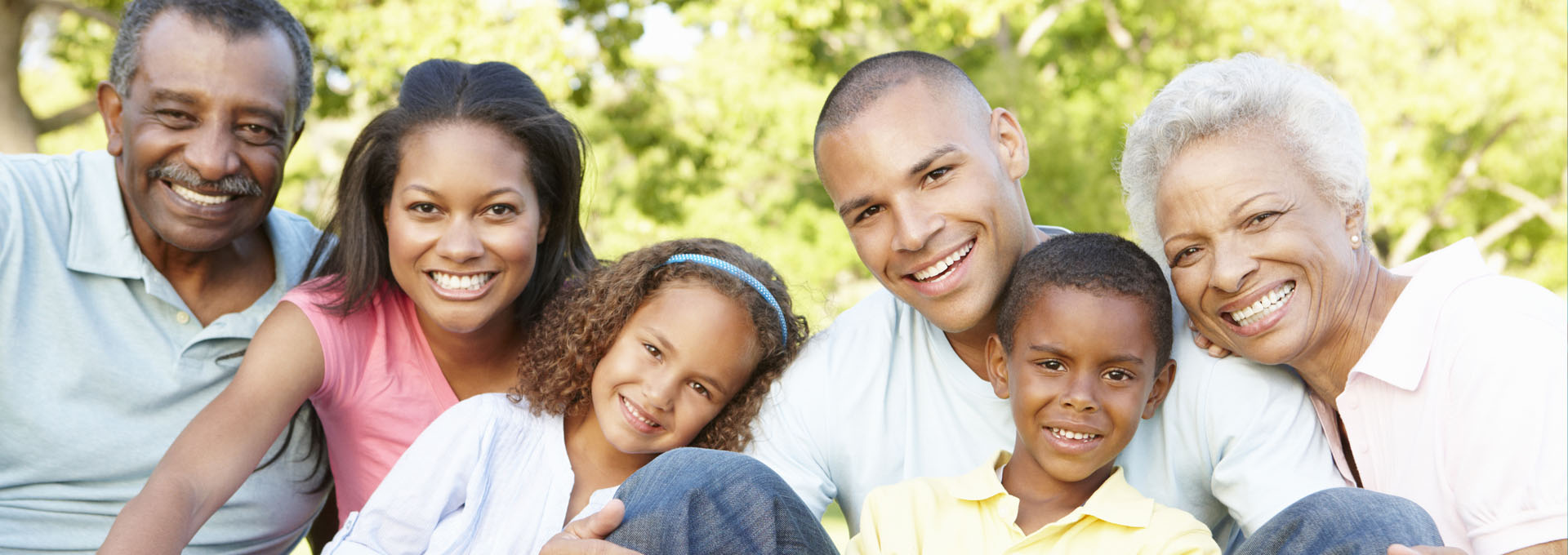 Happy Family Relaxing in Park